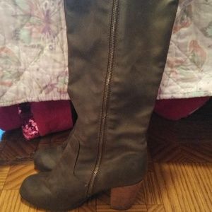 Khaki green zip up to the knee boots with a small